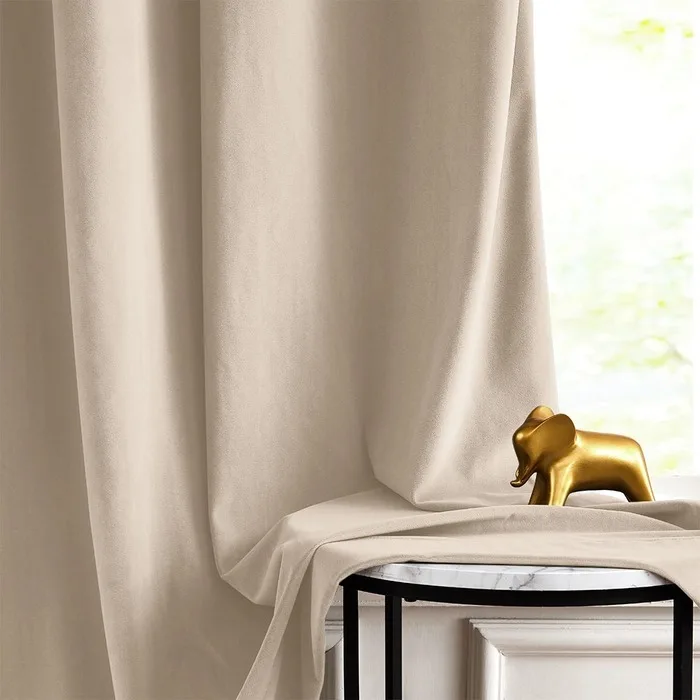 beige velvet curtain draped over a stool
