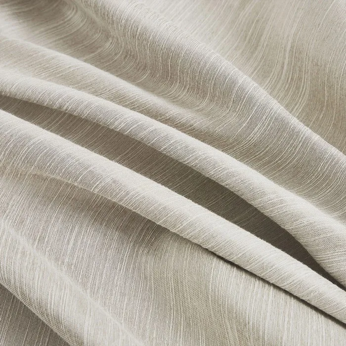 beige striped curtain fabric folds close-up