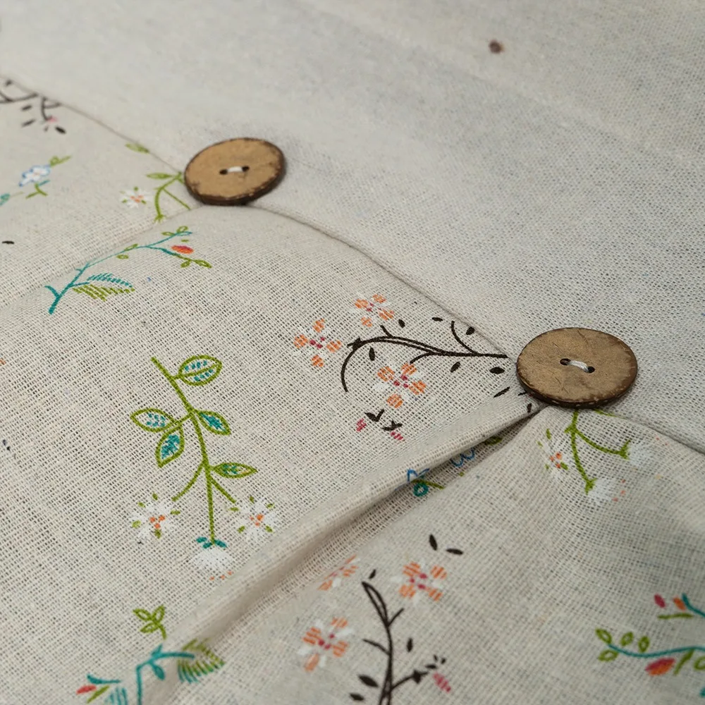 wood button and botanical print detail on kitchen curtain