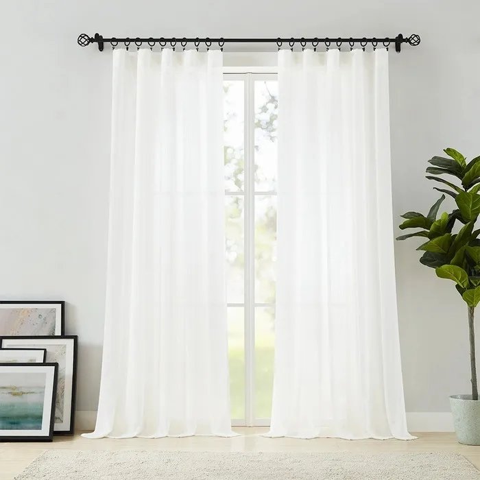 white linear-texture sheer curtains at a window