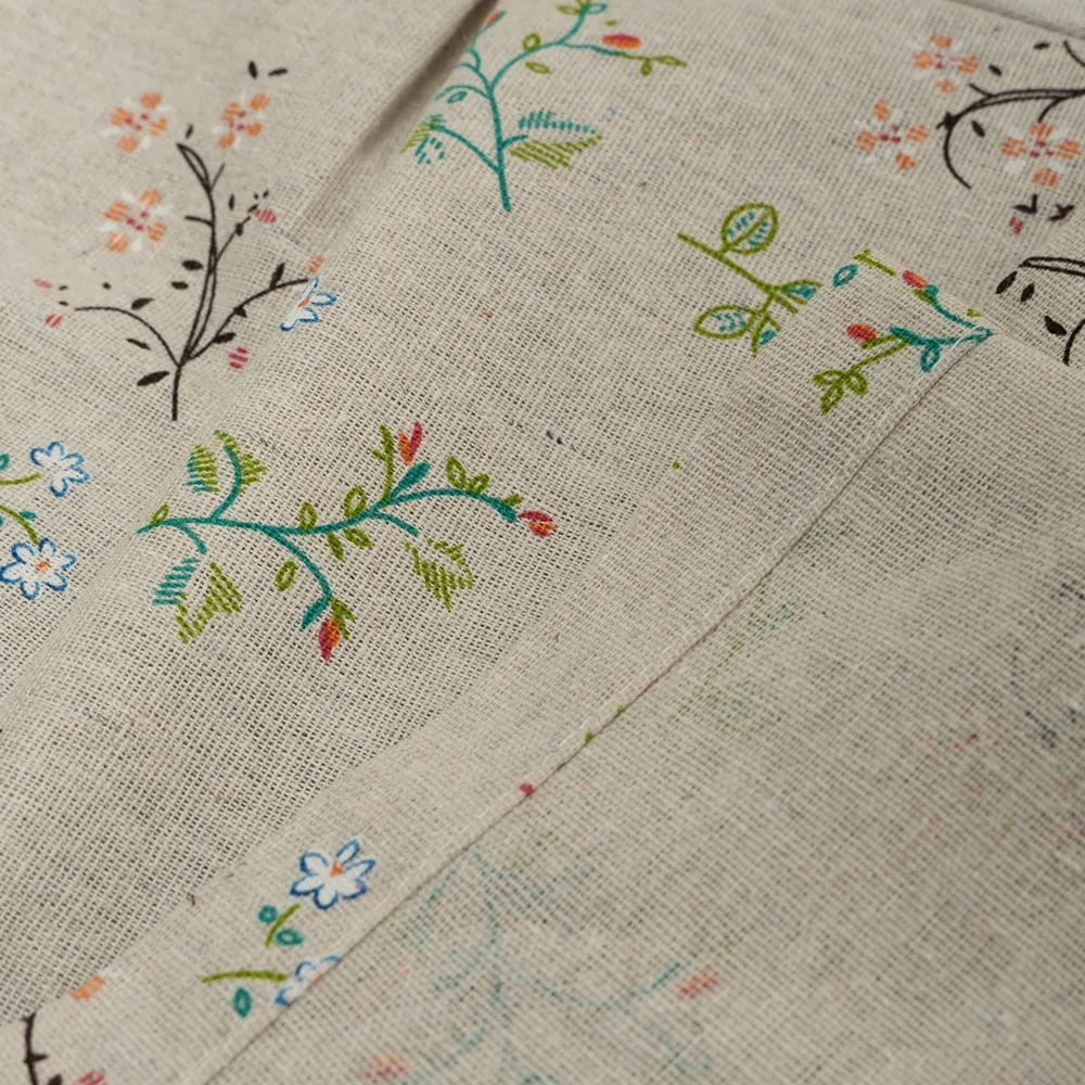botanical print and plain fabric sections on kitchen curtain