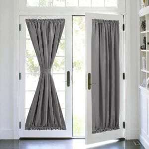 gray rod pocket blackout curtains on glass doors