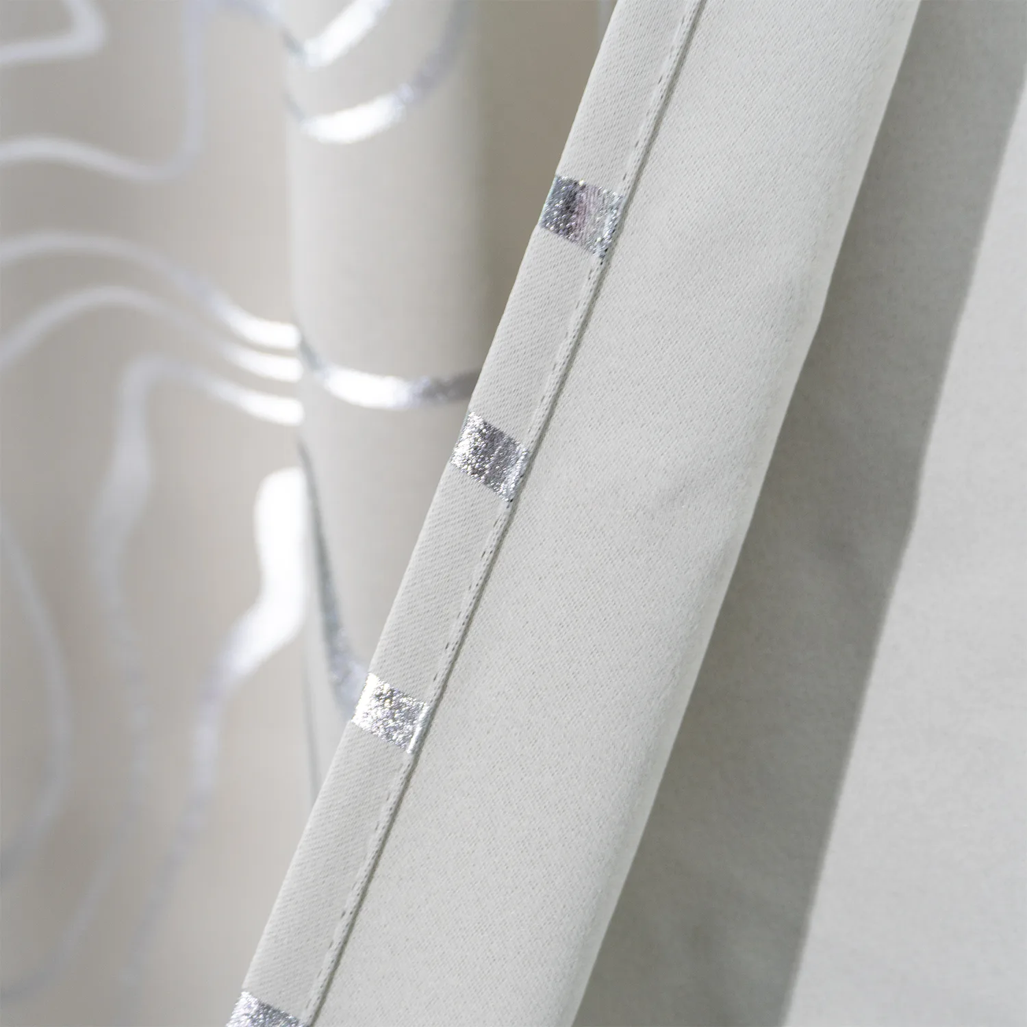 silver foil accent on stitched curtain edge