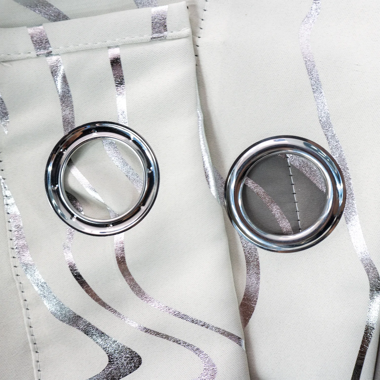 metal grommets on silver foil line curtain