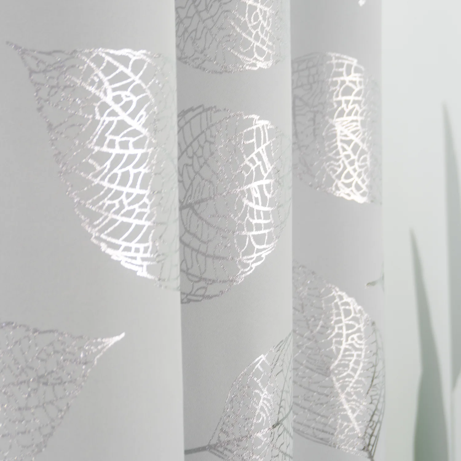 silver abstract foil motif on curtain panels