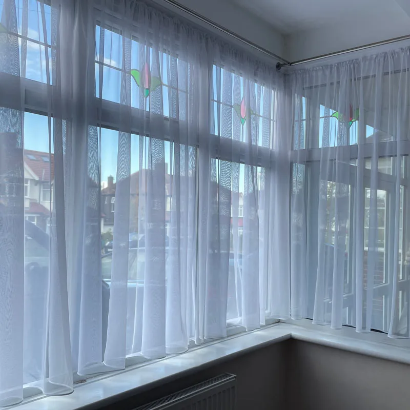 Embroidered voile curtain with floral pattern detail, demonstrating private-label customization potential