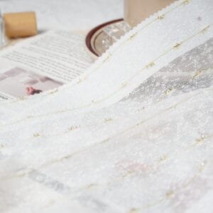 Decorative embroidered sheer curtain on 75 GSM polyester base for retail collections