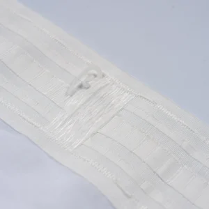 header tape and hook detail on white sheer curtain