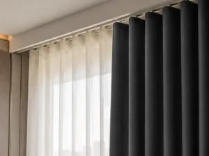 Ripplefold curtain heading showing even wave folds with carrier spacing on ceiling track