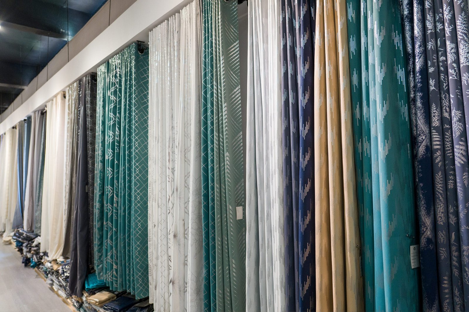 Assorted curtain fabrics in different colors and patterns for wholesale buyers