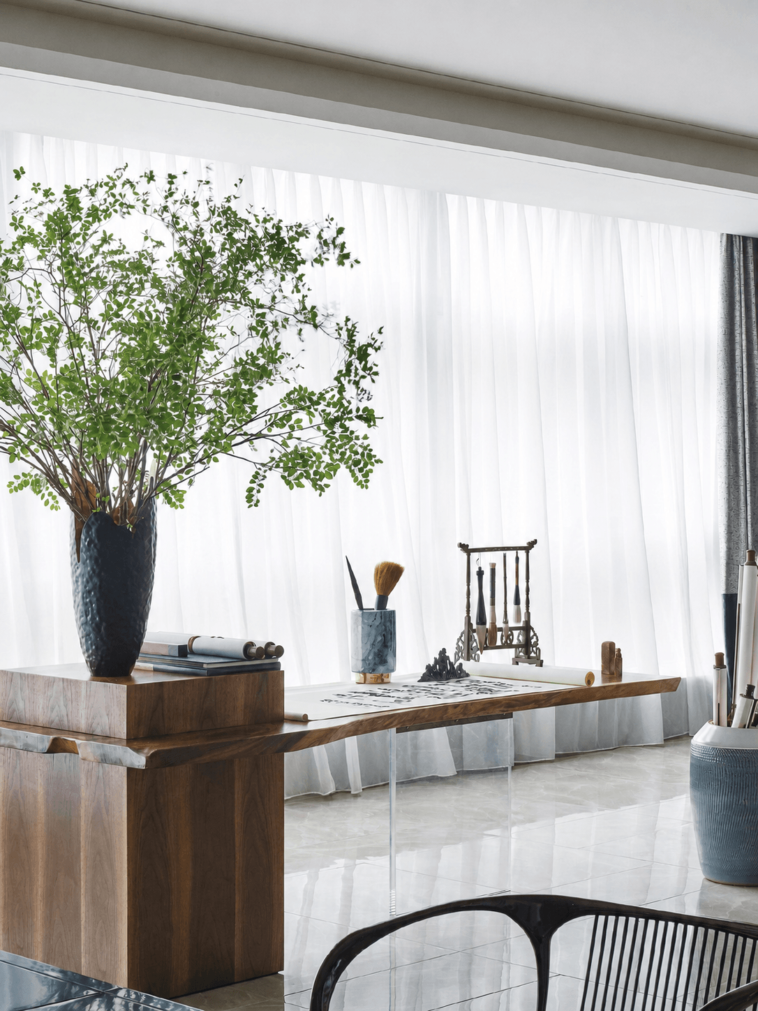 Manual curtain track installed above sheer curtains