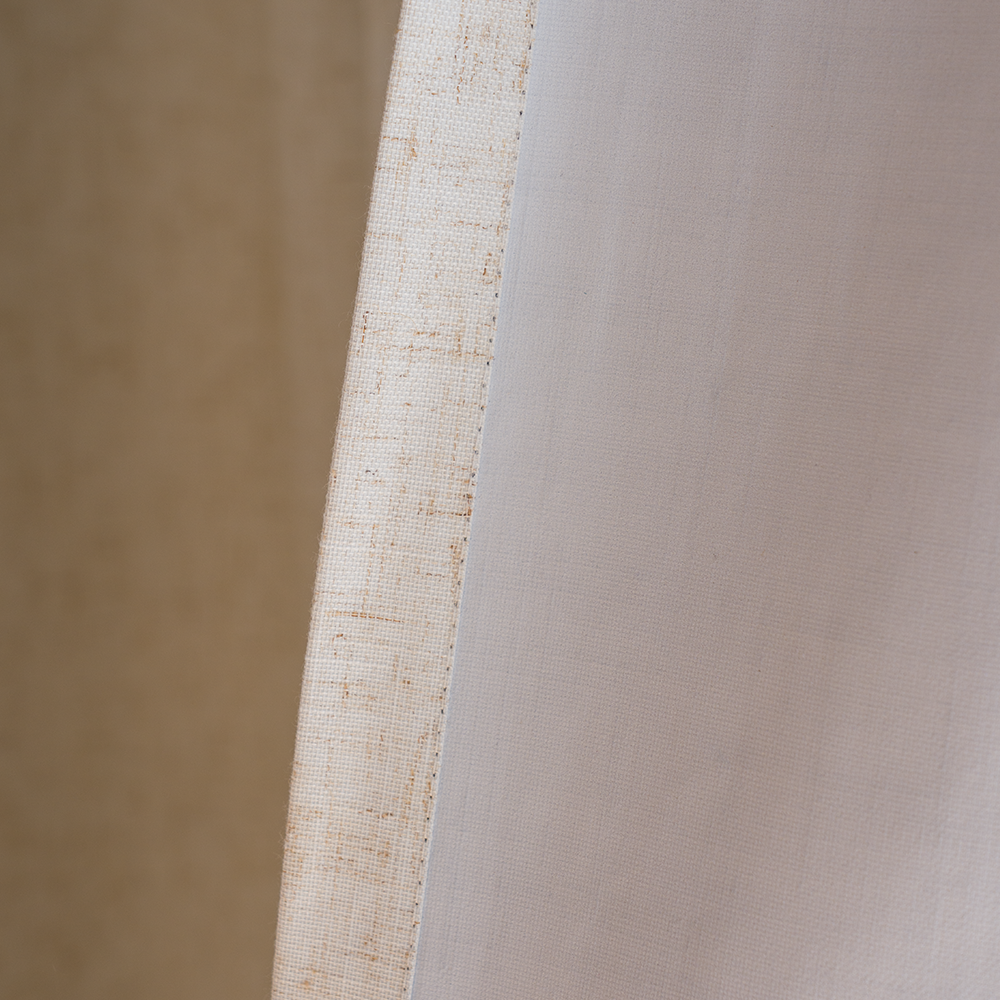 Beige blackout fabric showing face and light-colored backing