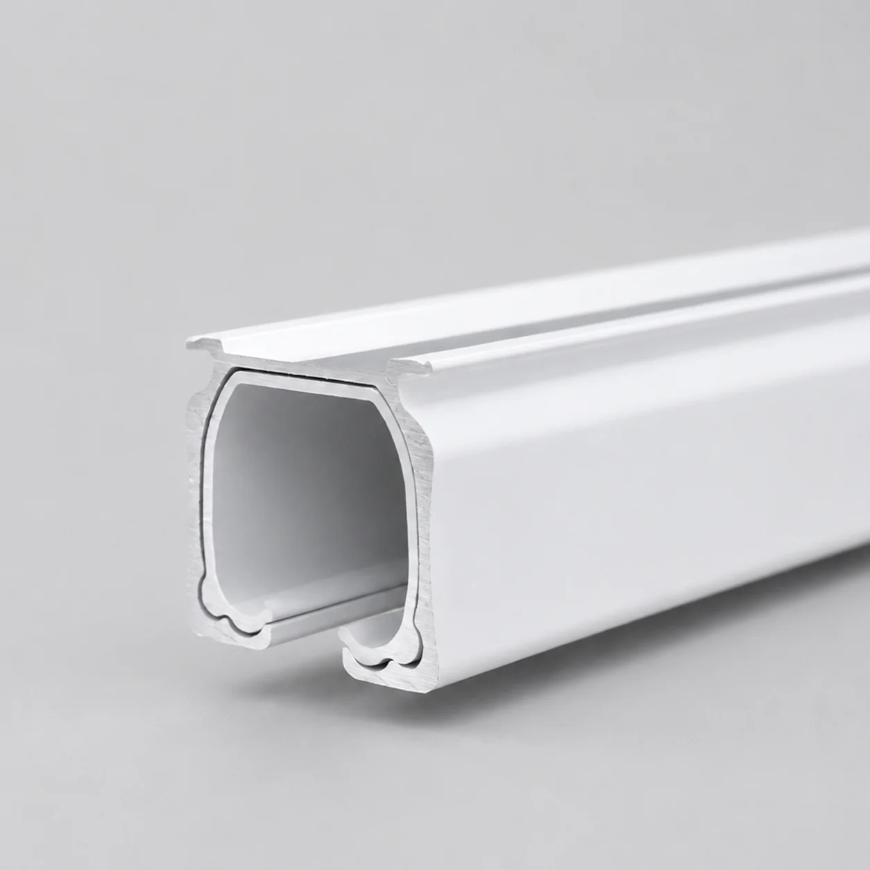 Curtain track profile cross-section showing the curved glider channel