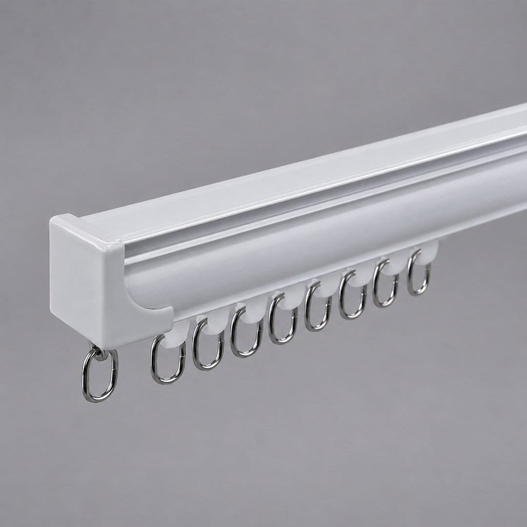 White aluminium curtain track with metal rings and moulded end cap