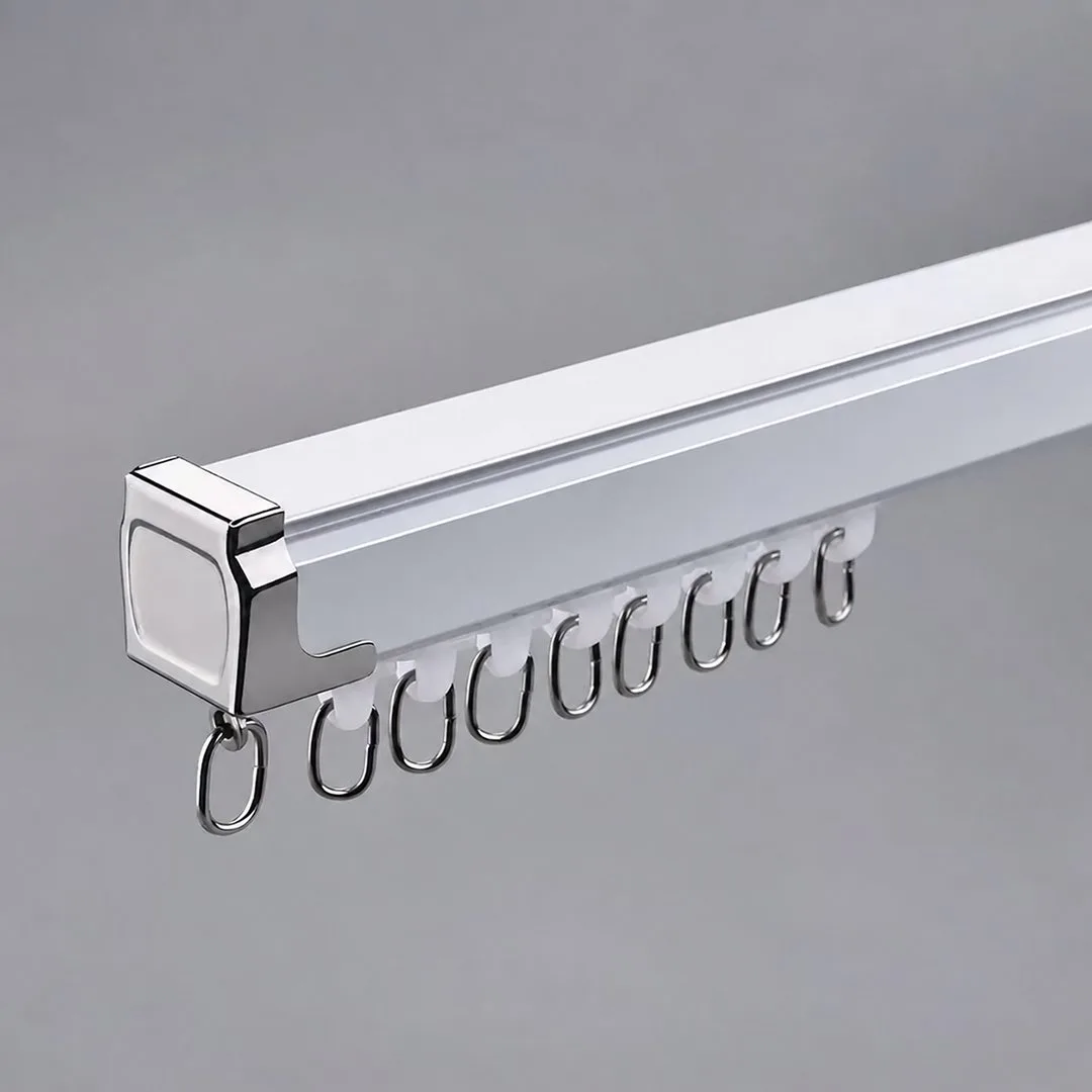 White curtain track with chrome end cap, gliders and metal rings