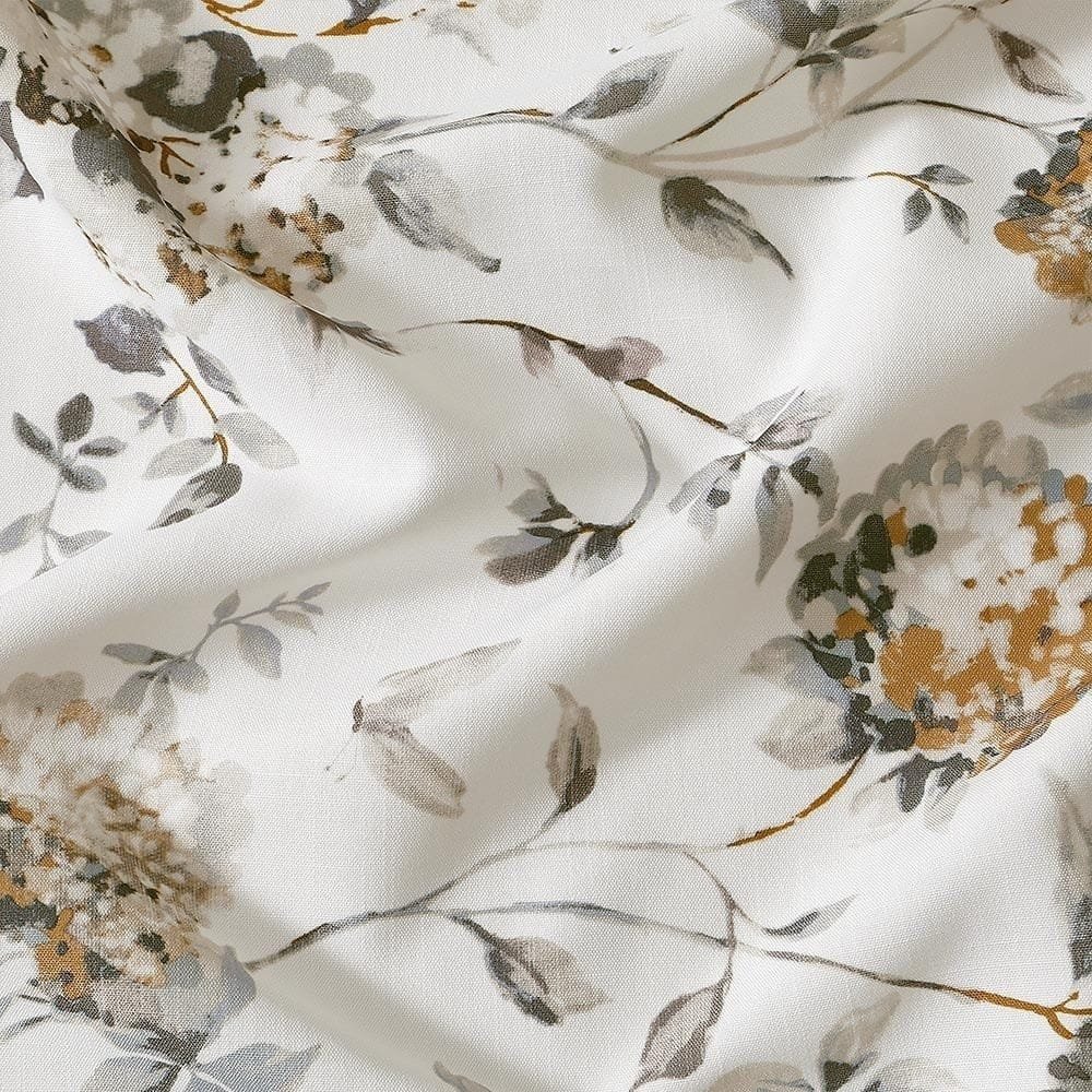 Close-up of floral printing on sheer curtain fabric